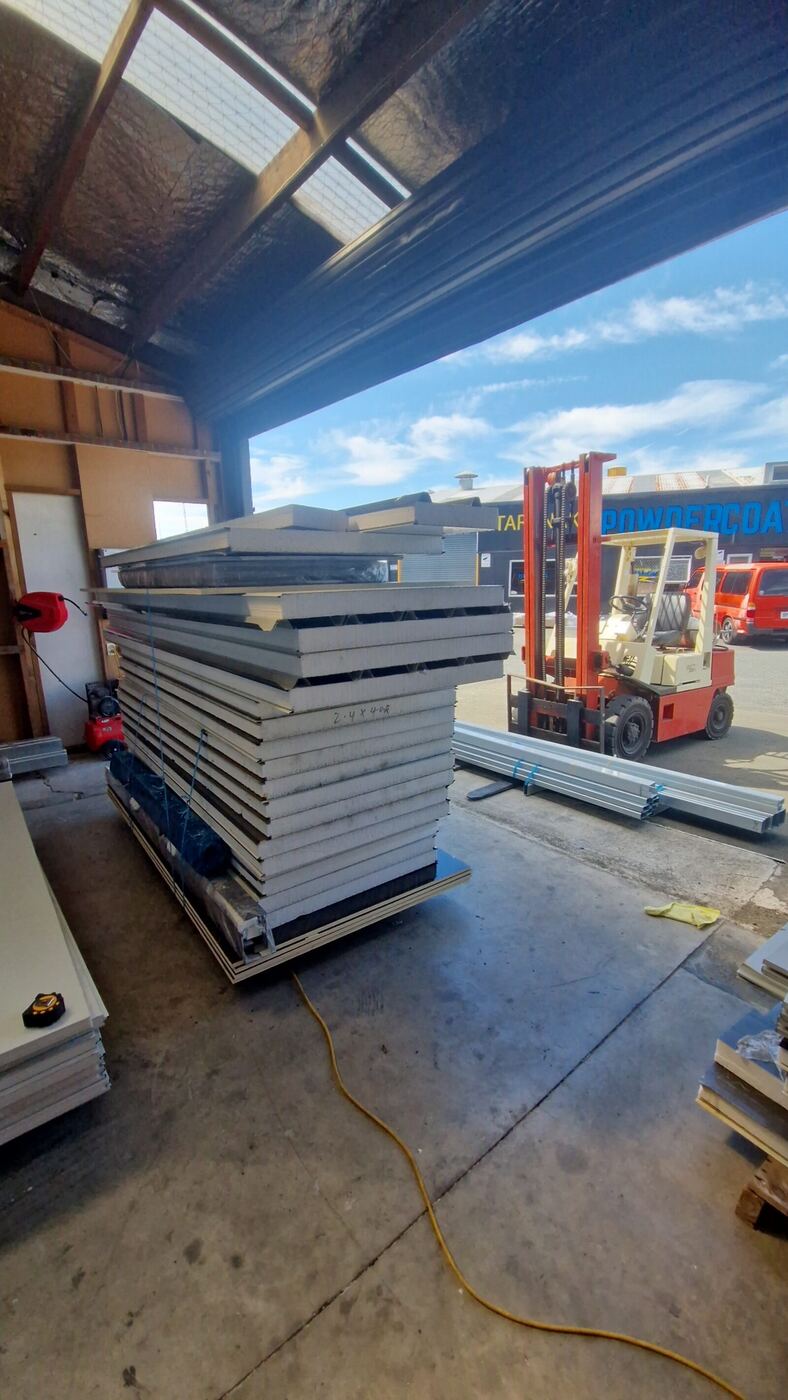 A stack of flatpack cabin panels ready for freight